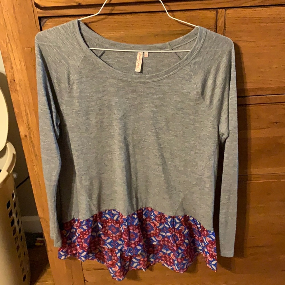 Grey top with ruffle hem